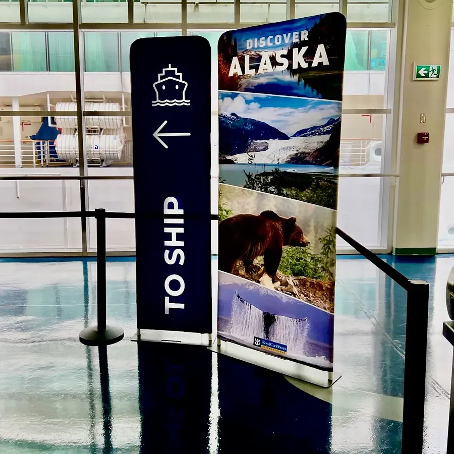 A sign saying 'Discover Alaska' and 'To Ship' at Vancouver Port