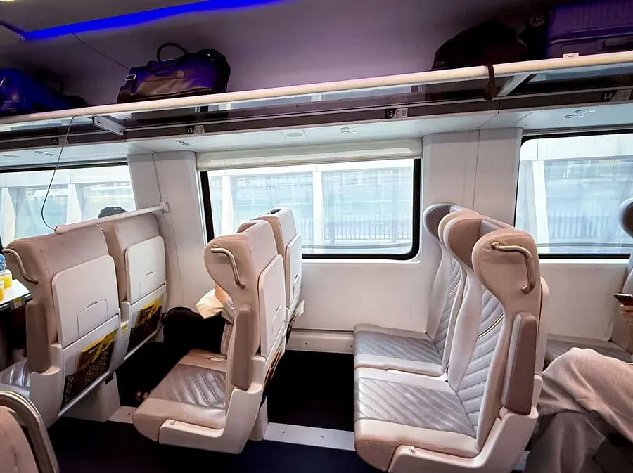 Interior of a Brightline train showing empty carriage seats 