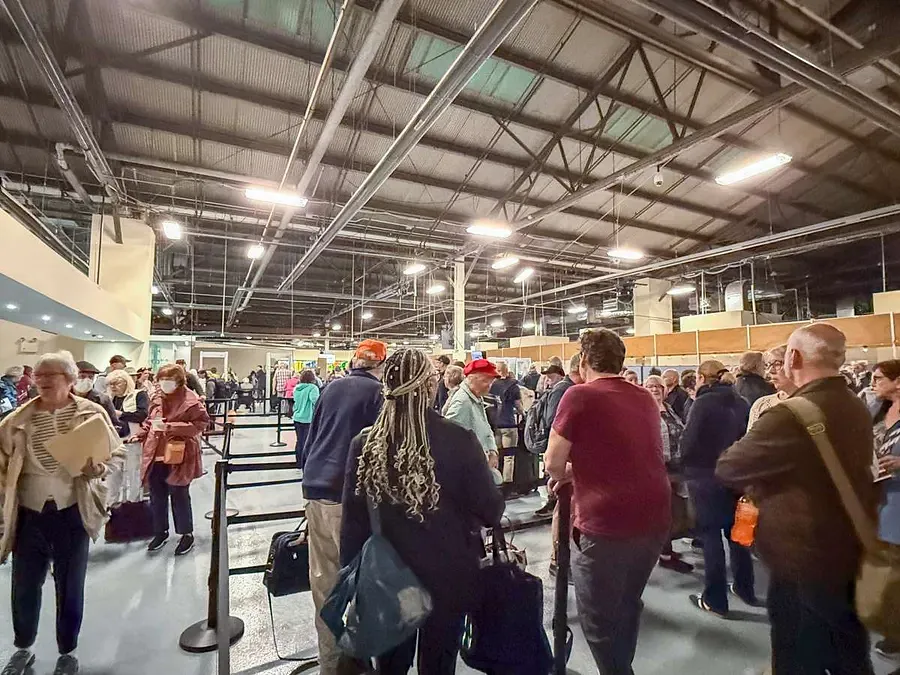 The line for check-in to the QM2