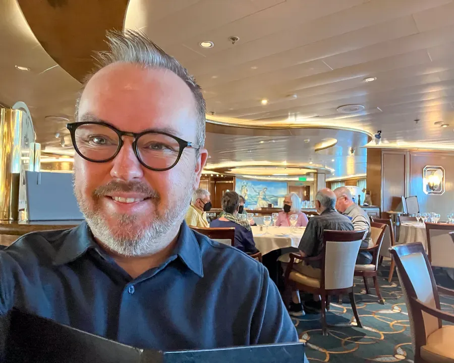 Selfie in the Grand Princess main dining room with ornate gold decor