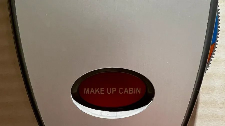 A cruise door dial reading Make Up Cabin
