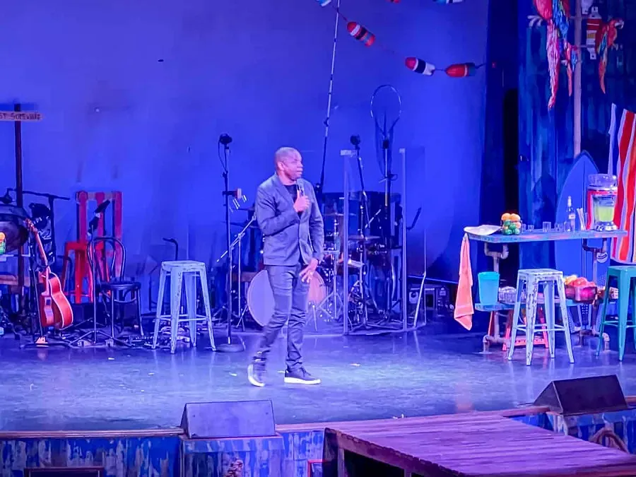 A comedian performing on Margaritaville at Sea