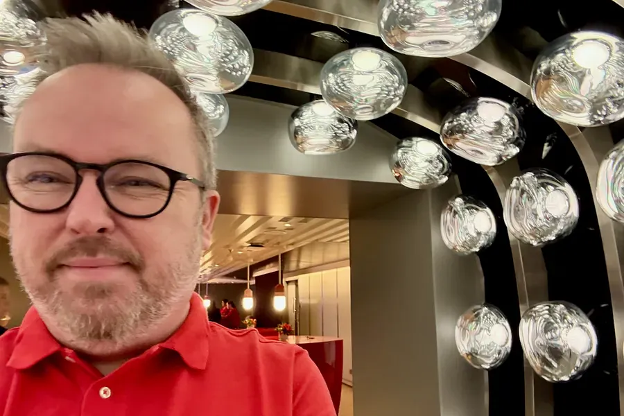 Patrick Hughes in the light tunnel at Pink Agave on Virgin Voyages