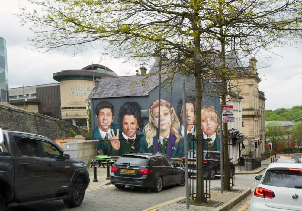 Derry city walls with the Guildhall and Peace Bridge beyond. Photo: Patrick Hughes