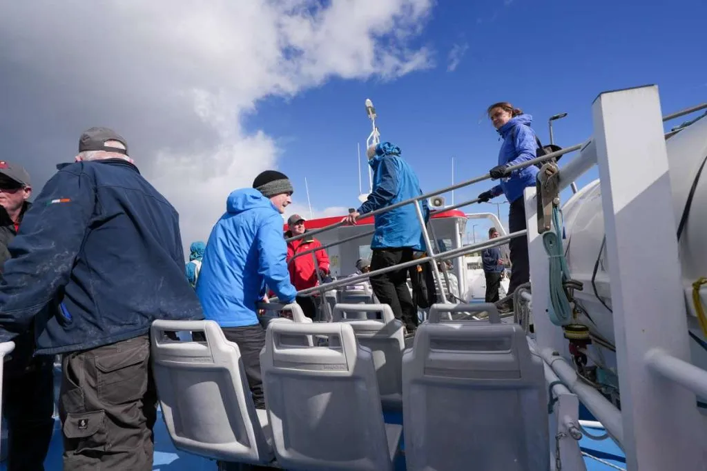 People getting on to a cruise boat at Doolin 