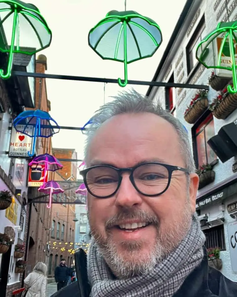 A smiling man on Commercial Court, Belfast