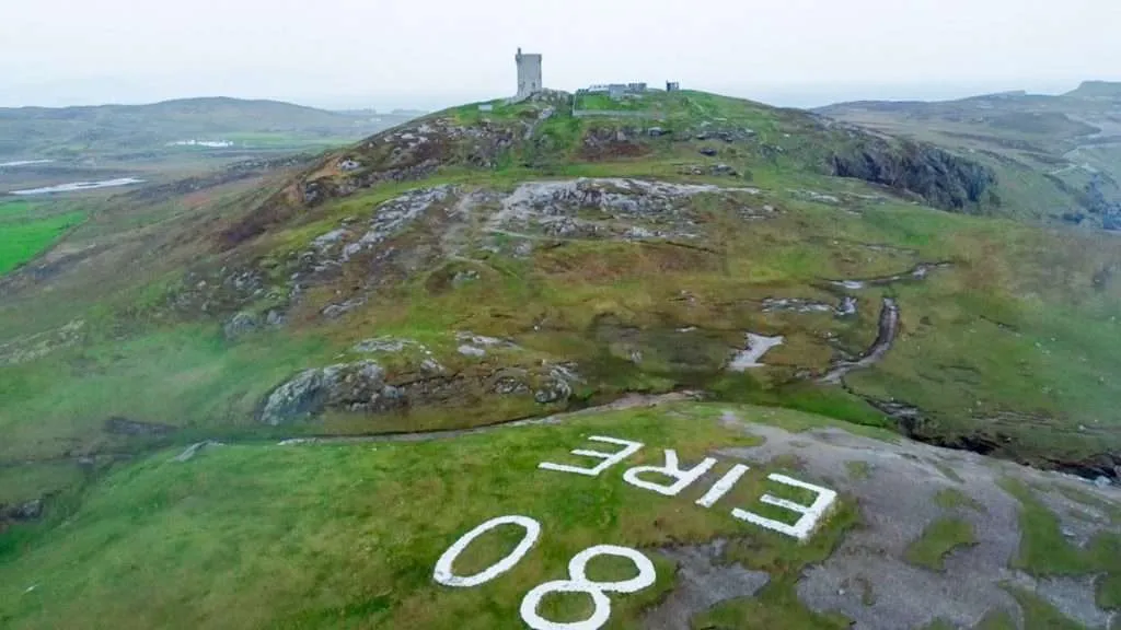 A drone shot of Malin Head EIRE sign 