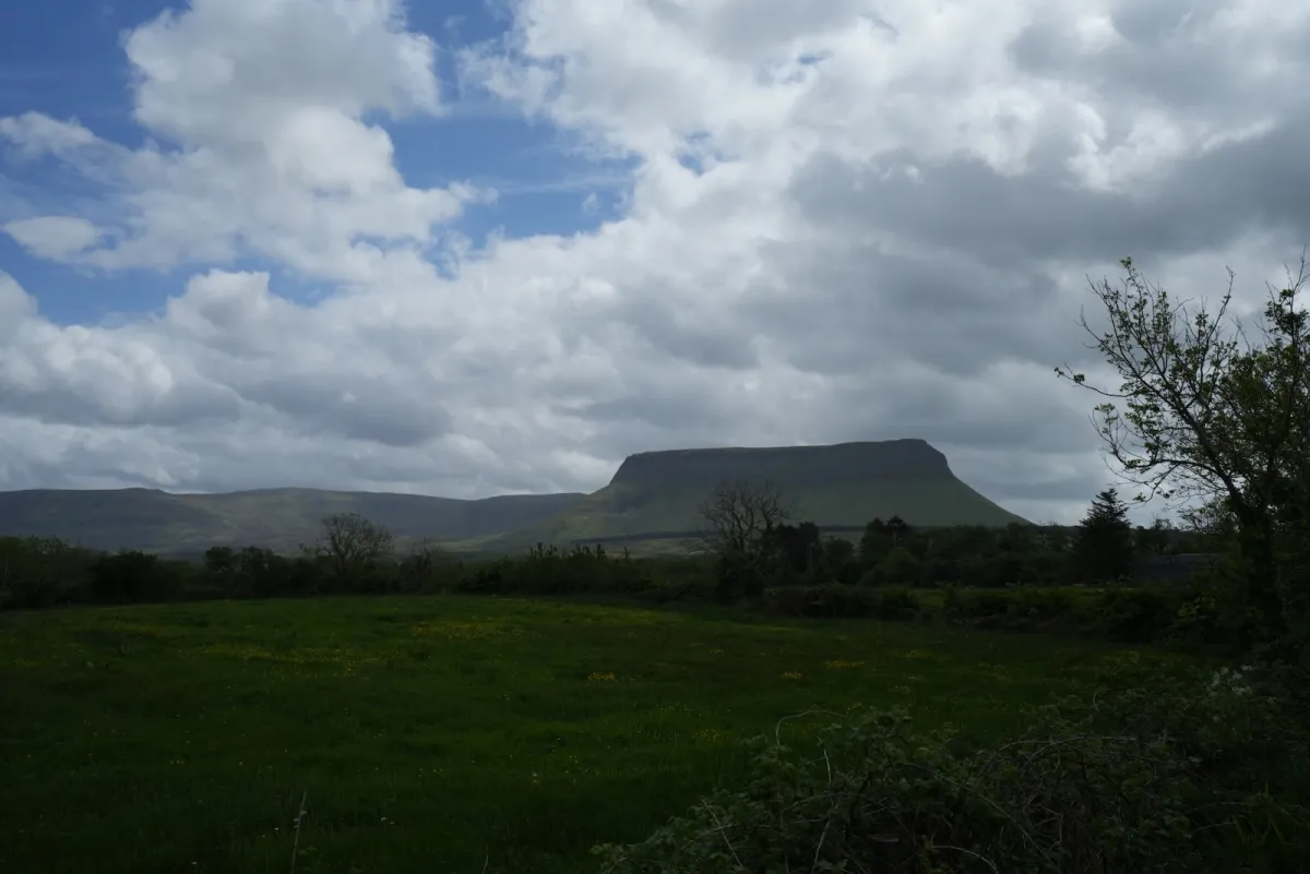 Benbulben's flat-topped table mountain rising above green Sligo farmland
