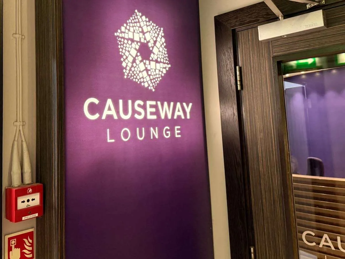 Sign at the Belfast International Airport lounge reading Causeway Lounge
