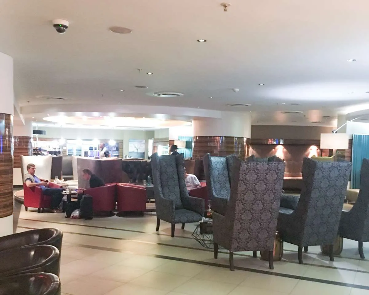 Layout of Shongololo Lounge with wing-backed armchairs. 