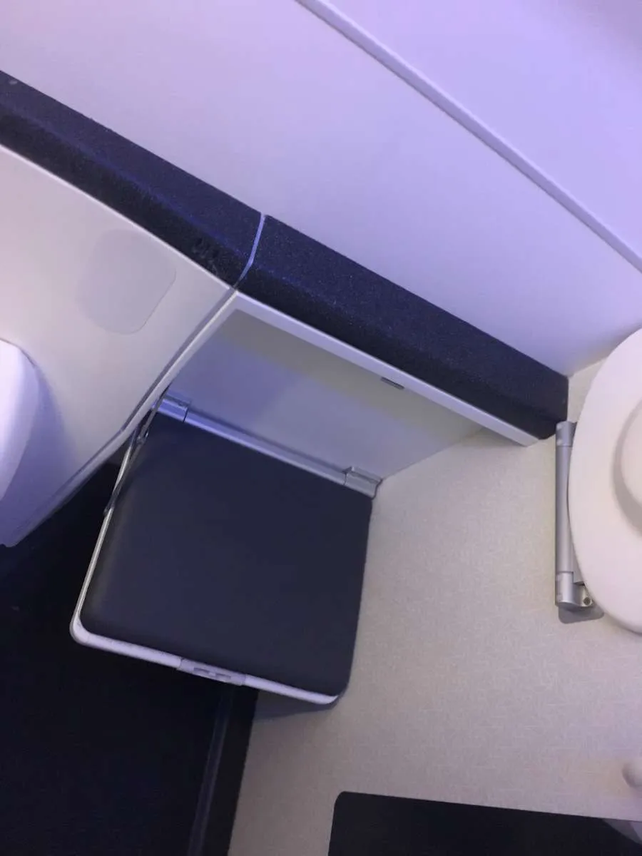 A fold out seat helpful for getting changed in the Upper Class bathroom on Virgin Atlantic 
