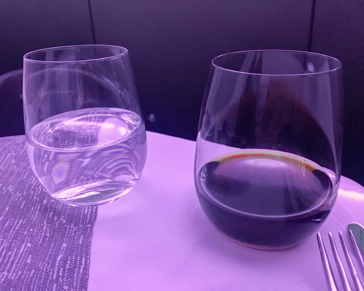 A glass of red wine and a glass of water
