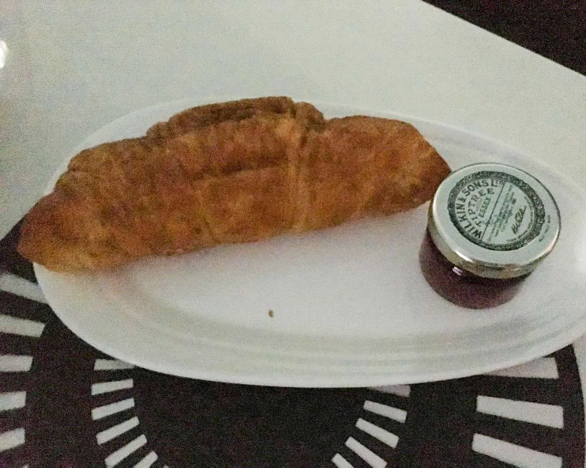 A rather flat croissant served with TipTree jam on Virgin Atlantic 