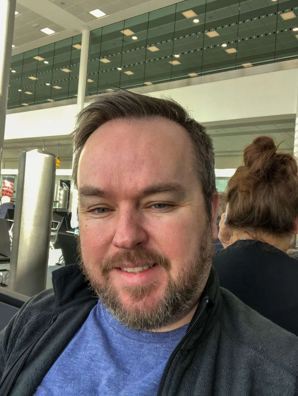 Qantas QF10 Flight Review - Patrick is sitting in the holding area after pre-screening and before boarding his flight to Perth 