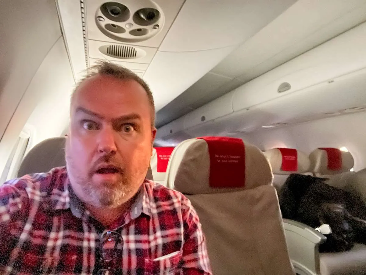 Patrick looking shocked at the business class seat on LOT Polish Airlines