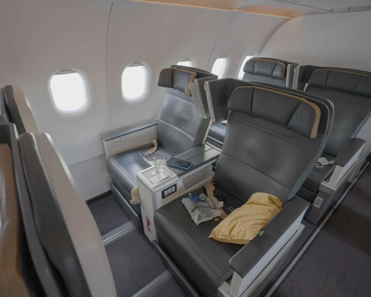 A saffron-coloured pillow is provided in business class.