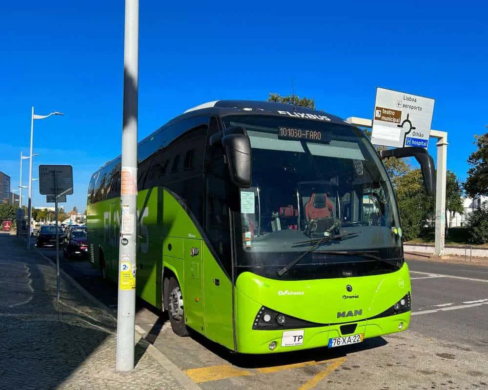 A green Flixbus arrives at the Faro bus stop in Portugal 