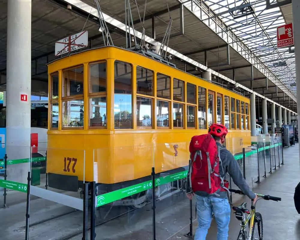 An old yellow tram at Seville bus station 