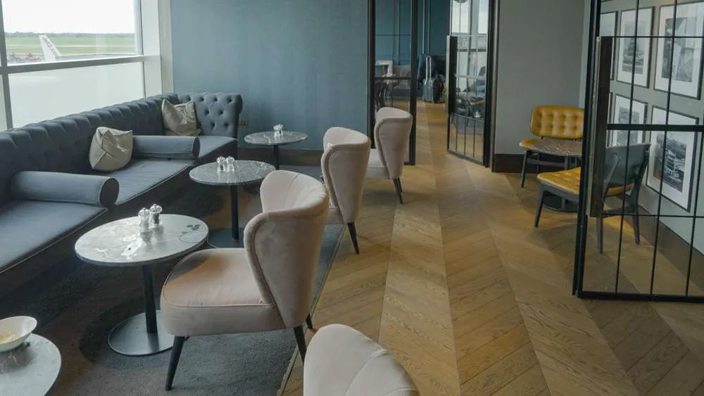 Interior of the Clubrooms Lounge in Birmingham Airport with grey upholstery. 