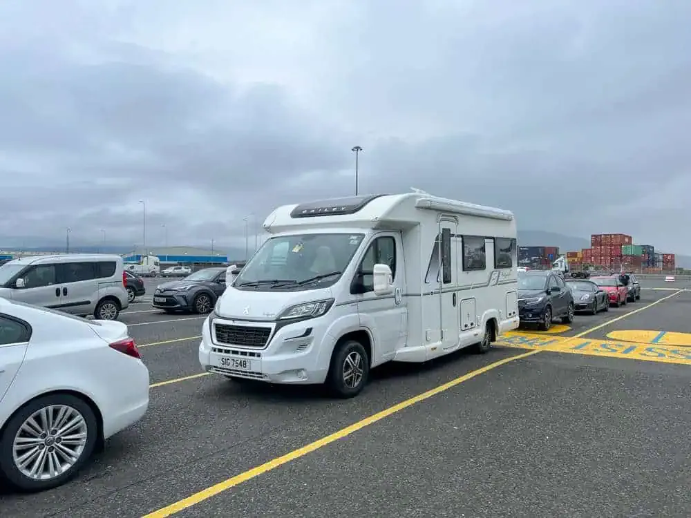 Patrick's campervan is shown waiting in line at Belfast Port 