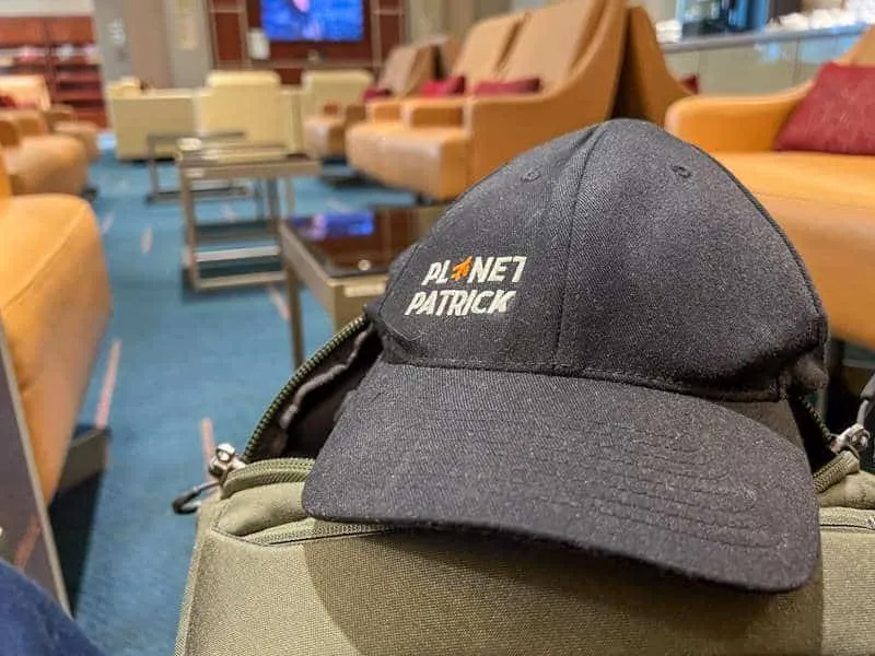 A baseball cap reading "Planet Patrick" in white letters on a black background. 