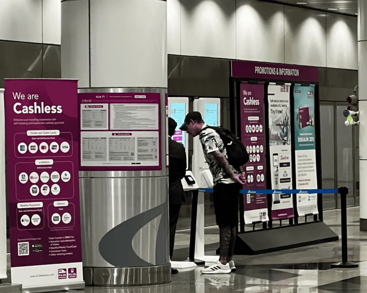 A couple buying tickets for the KLIA Ekspres