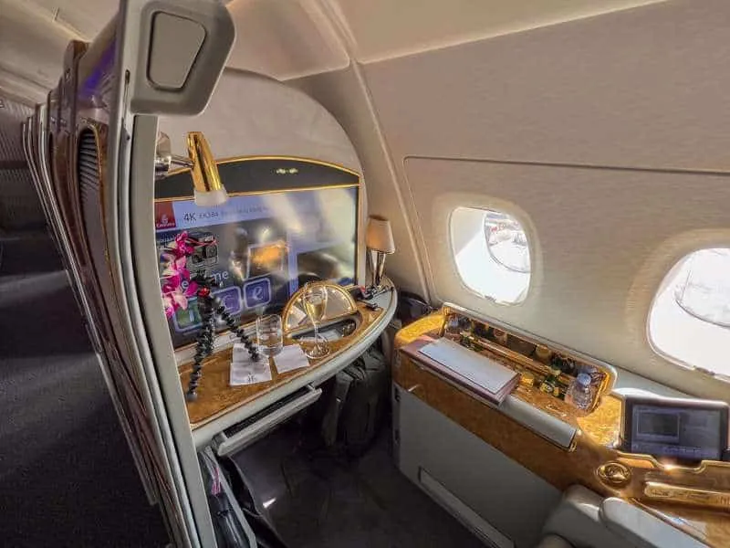 A private suite on Emirates with gold details around every feature
