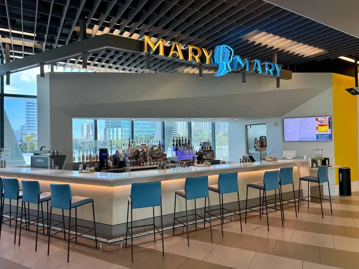 Blue dining stools along a bar counter named Mary Mary