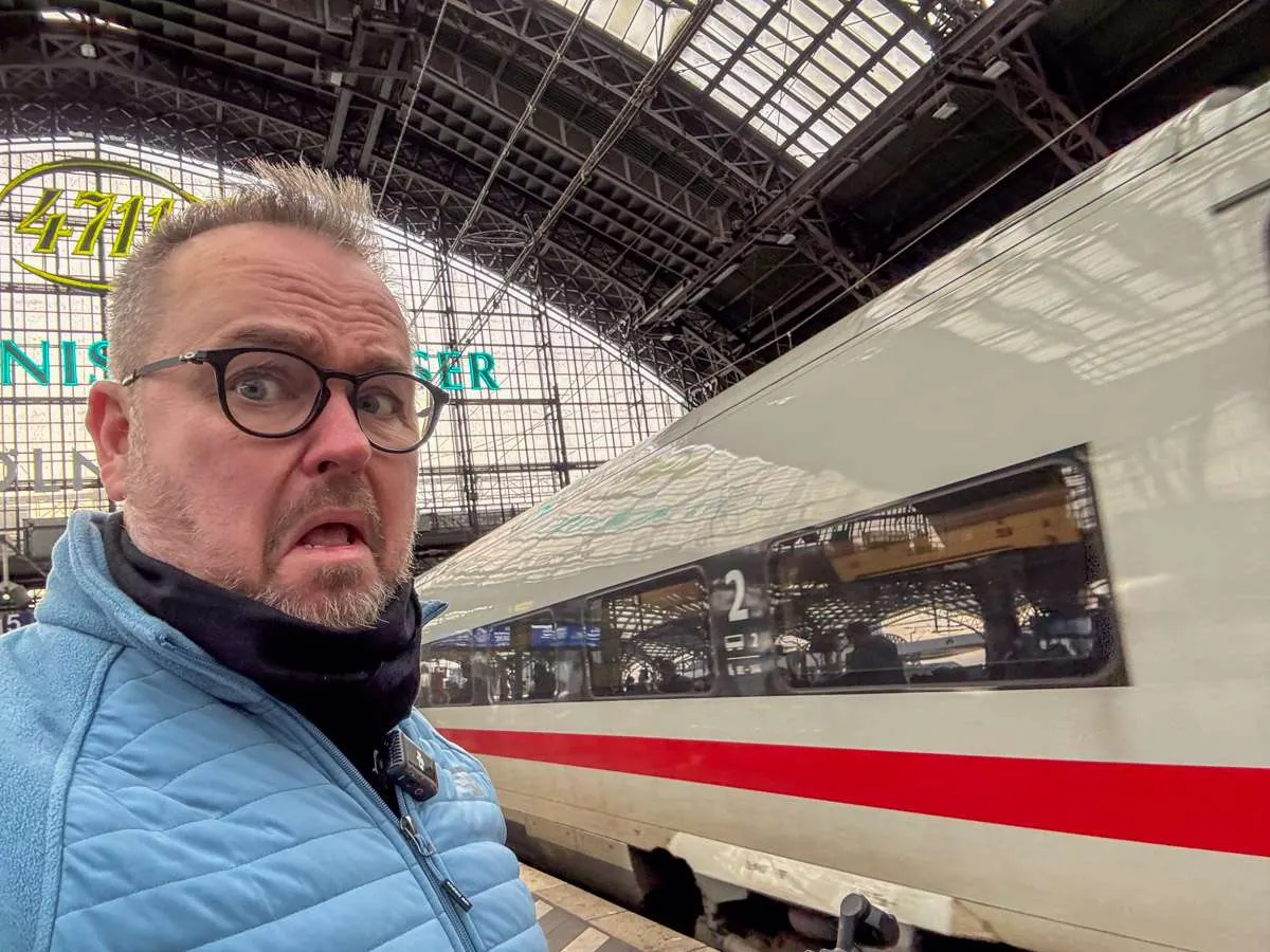 Patrick Hughes on a train platform as an ICE train goes by