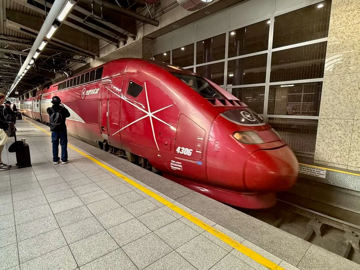 A red Thalys train coming into Brussels Midi station