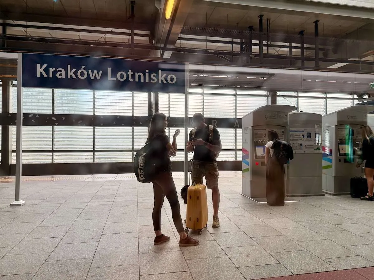 People waiting at Krakow Airport station for the train