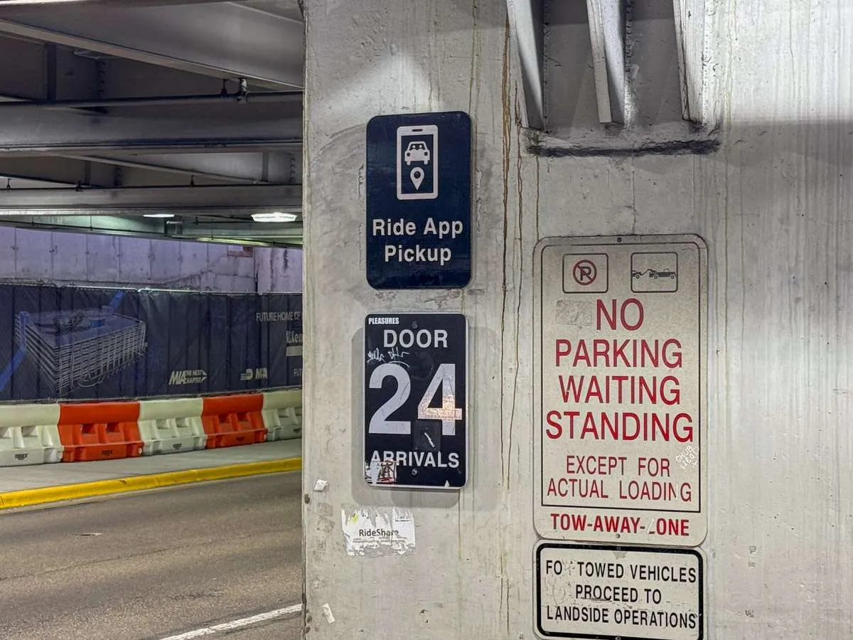 Ride App Pickup sign beside Door 24 on the Arrivals level at Miami International Airport