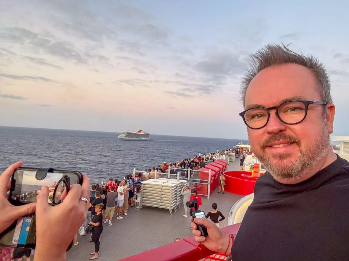 Patrick on a Virgin Voyages ship looking out across the horizon