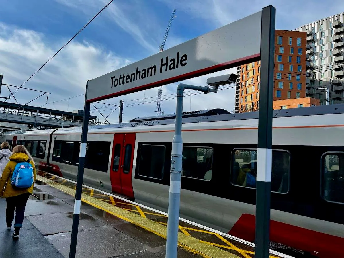 A train station sign reading Tottenham Hale