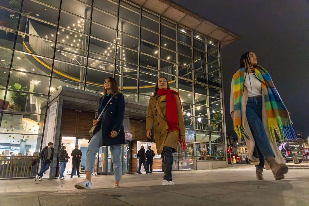 People out shopping in Cork after dark