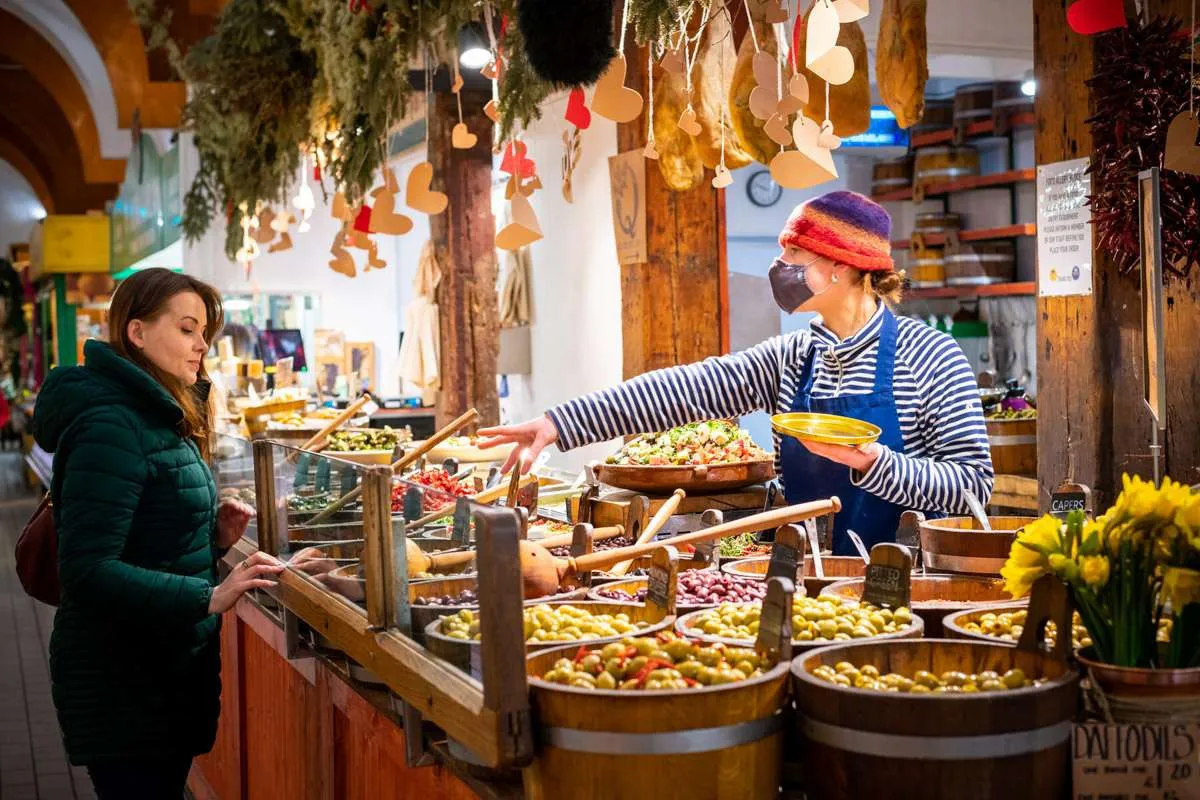 A customer is served in the English Market in Cork City