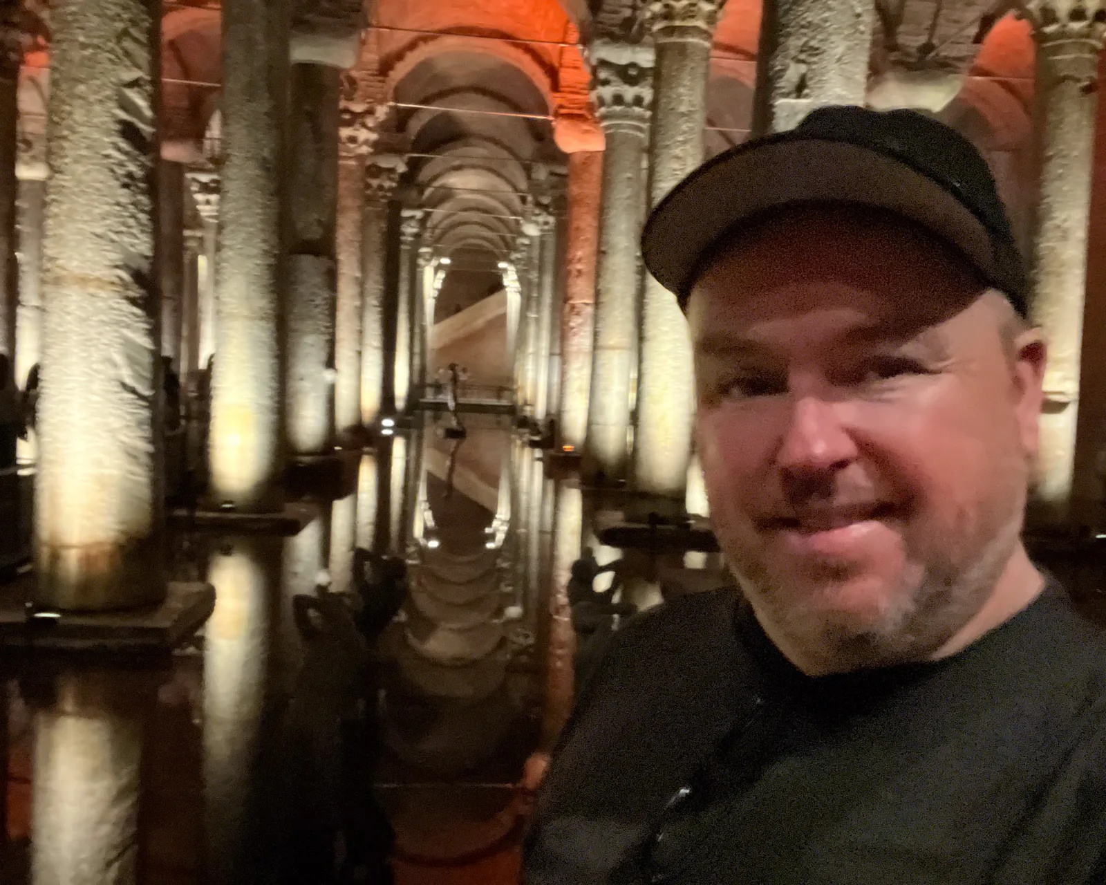 Patrick at the Basilica Cistern, columns and reflections receding into the dark behind him