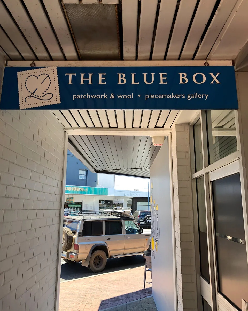 Blue Box exterior with crochet wall hanging