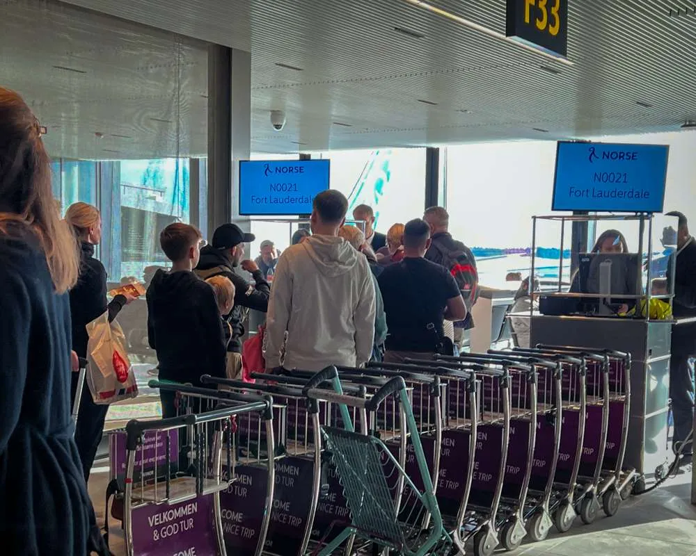 A line of people boarding a Norse Atlantic flight