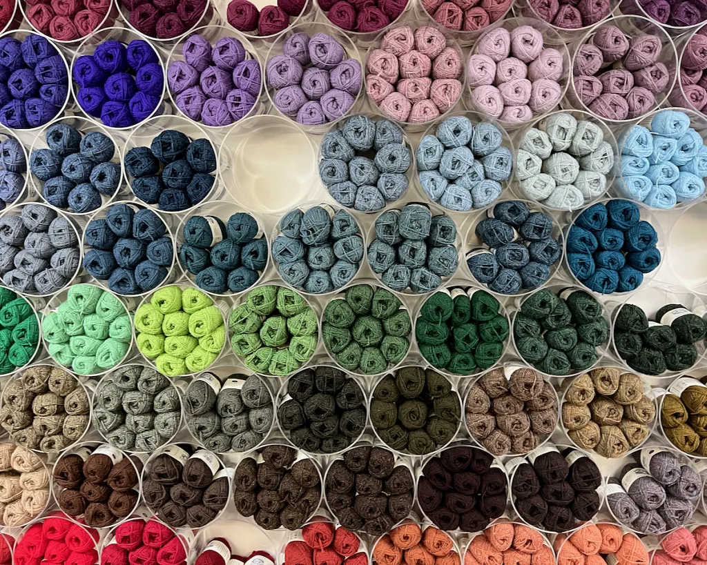 A colourful wall of yarns at Jamieson's of Shetland