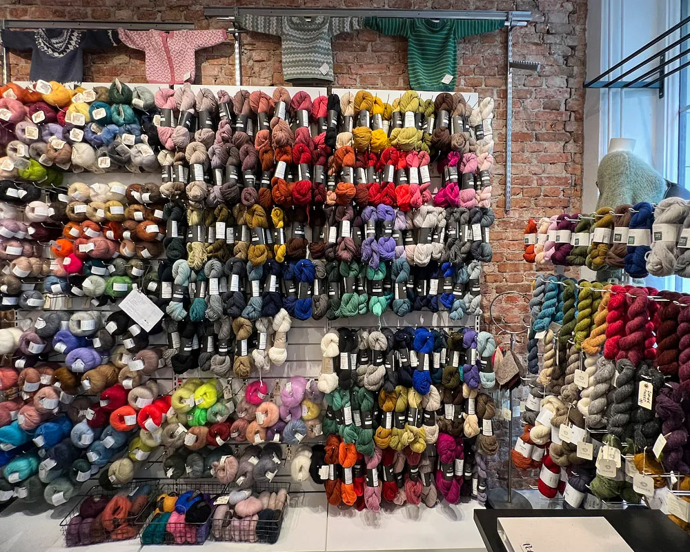 A colourful wall of yarn in a Gothenburg craft store