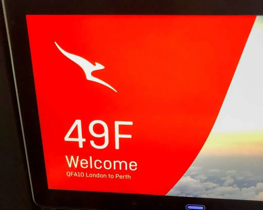Initial drinks and snack service on Qantas QF10 economy class