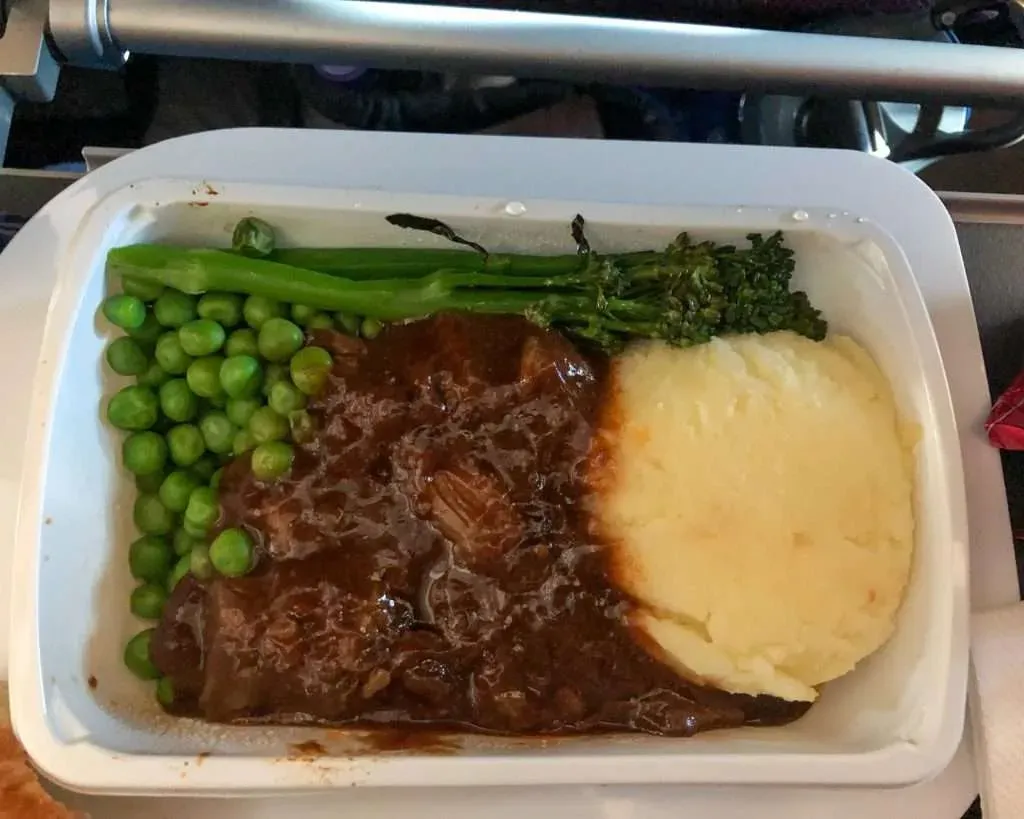 Qantas economy class dinner tray with dessert on QF10