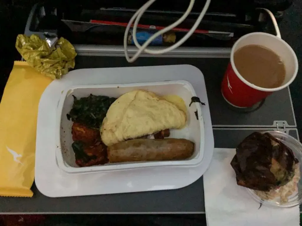 Qantas QF10 economy breakfast close-up - Cumberland sausage, egg and vegetables