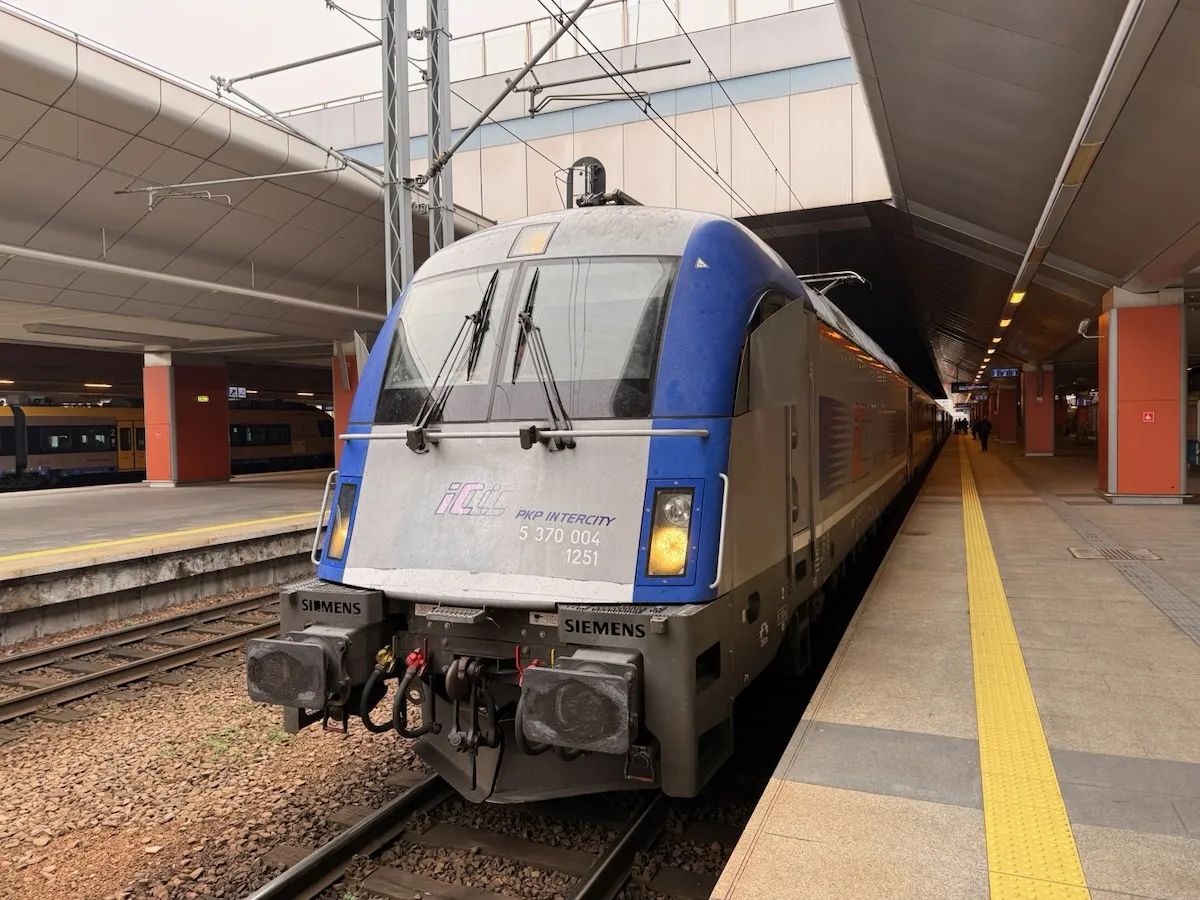 PKP locomotive pulling older-stock EuroCity compartment carriages