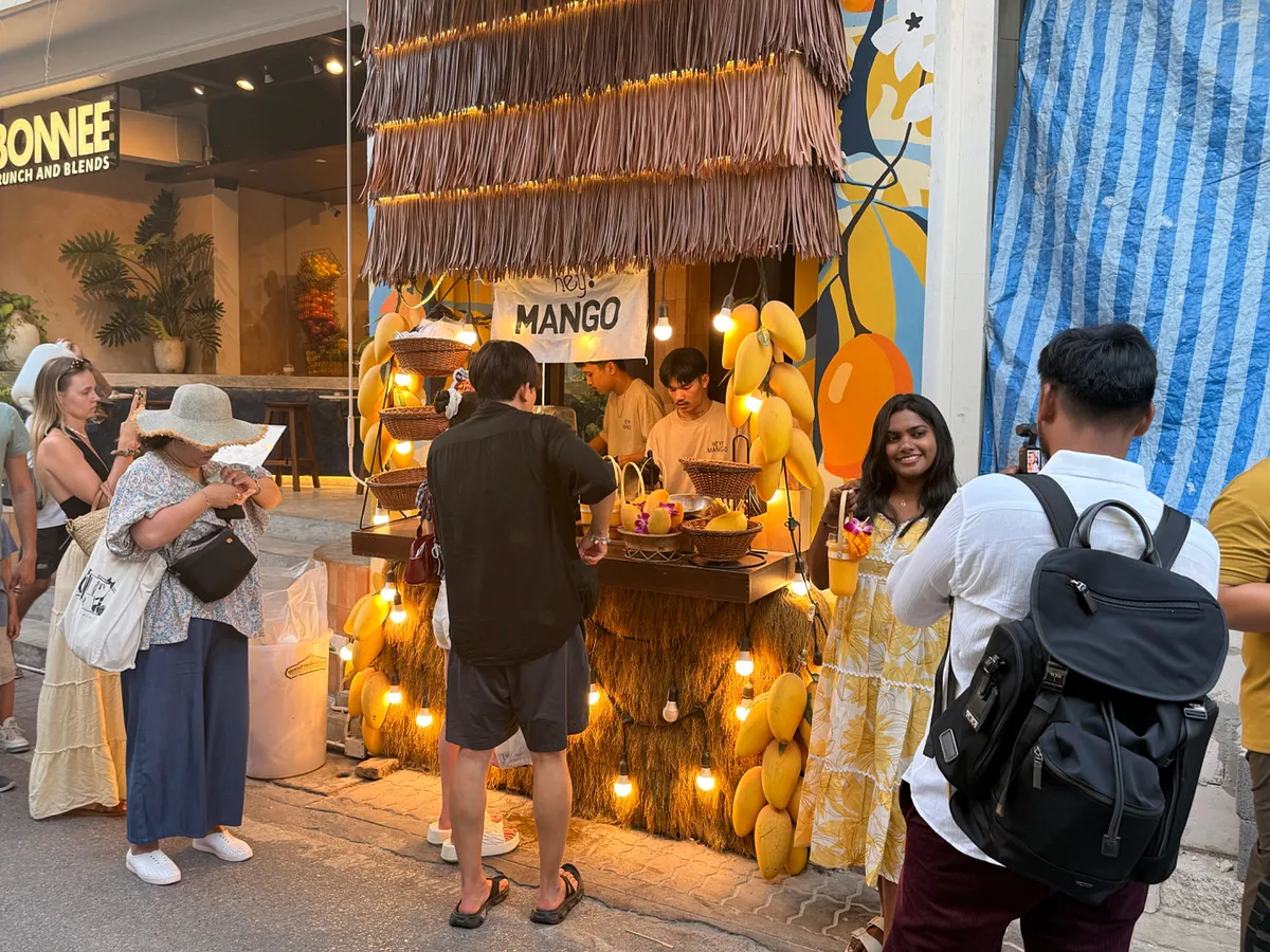 Mango smoothie stand with thatched roof on street in Phuket Old Town